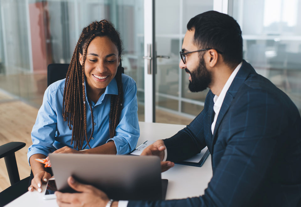 Securian Canada customer meets with a company representative in an office.